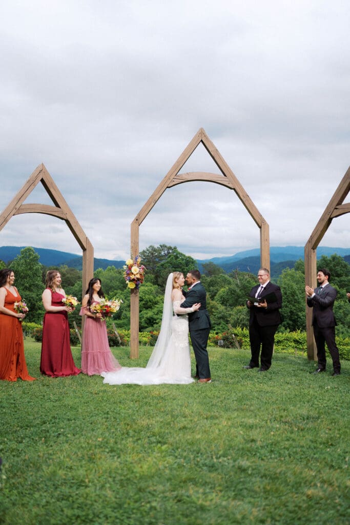 Bride and groom share first kiss at Harper’s Vineyard wedding in May