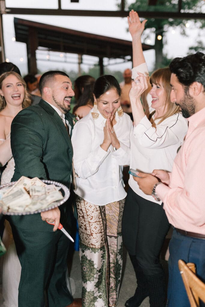 Guests dancing during wedding reception at Harper’s Vineyard in May.