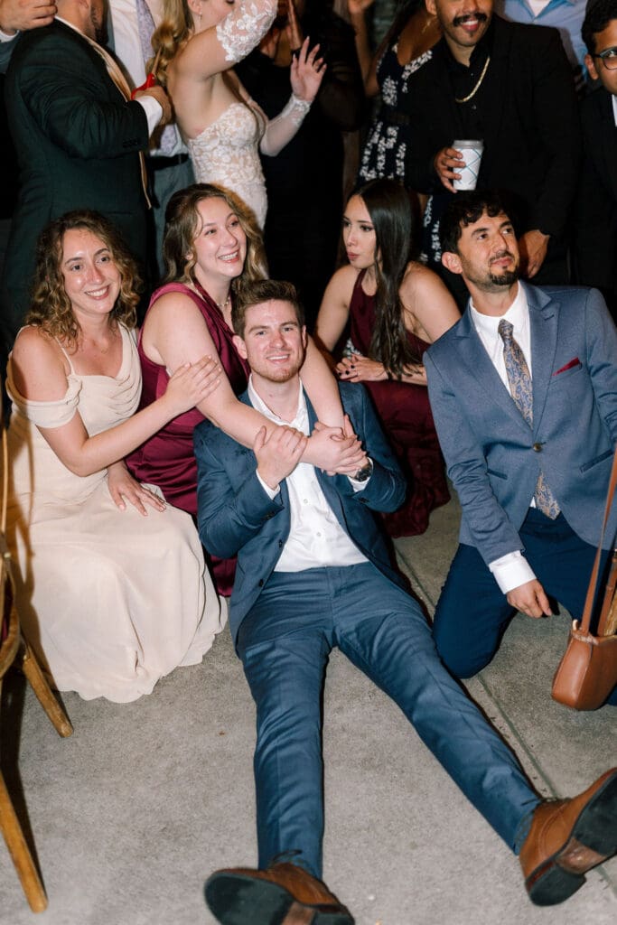 Guests dancing during wedding reception at Harper’s Vineyard in May.