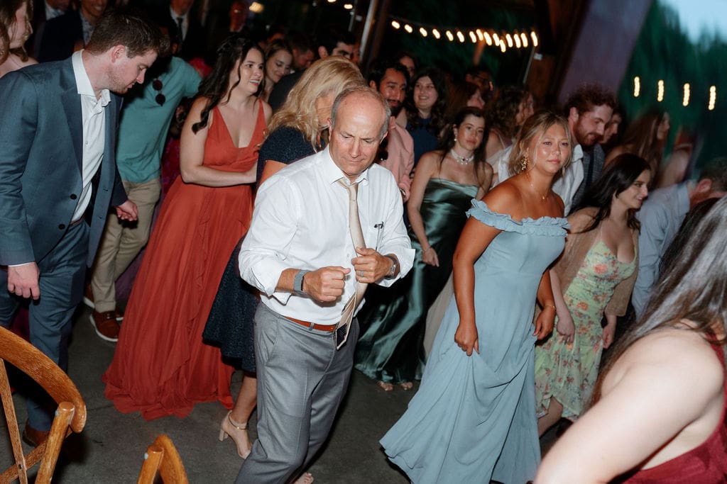 Guests dancing during wedding reception at Harper’s Vineyard in May.