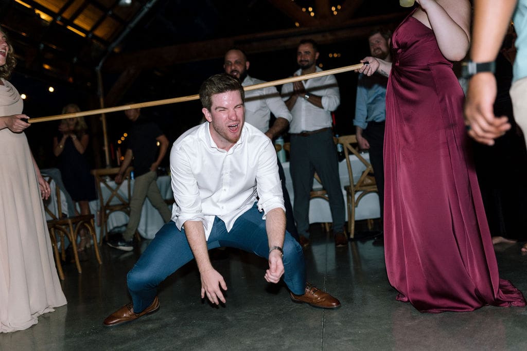 Guests dancing during wedding reception at Harper’s Vineyard in May.