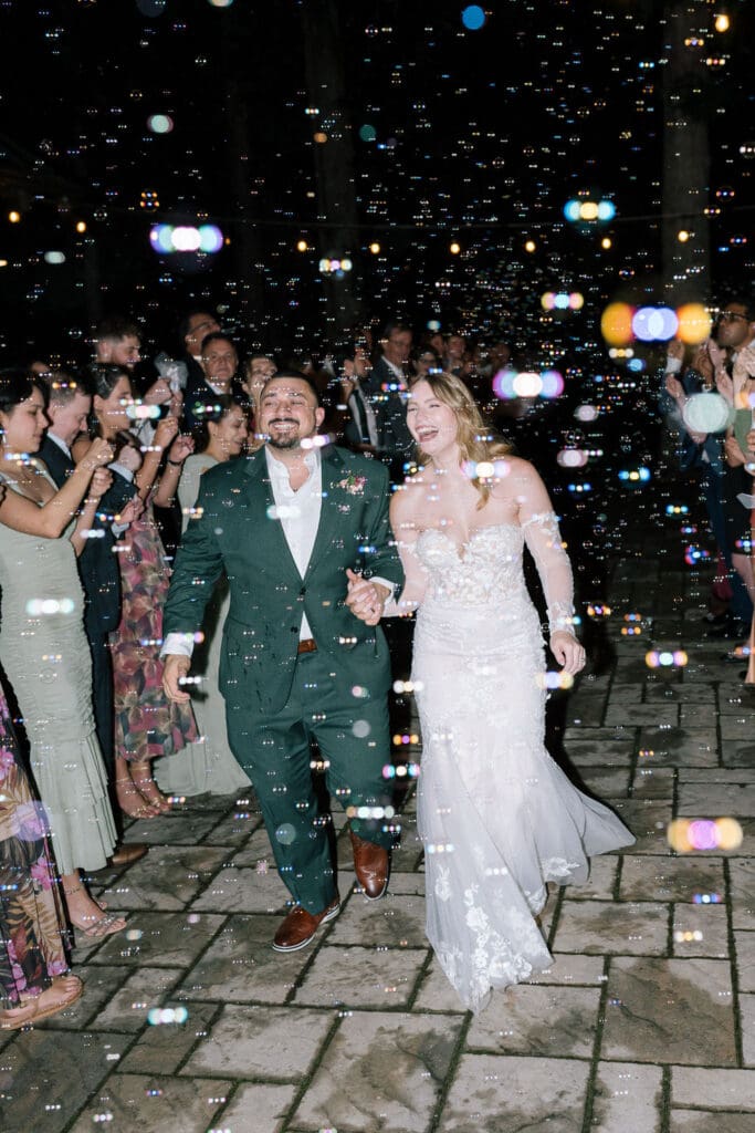Bride and groom bubble exit at vineyard wedding venue near Knoxville.