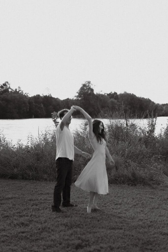couples dances on riverbank at seven islands state birding park in knoxville tennessee