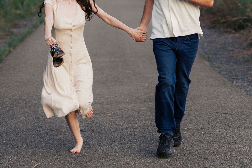 couple runs on walking trail at seven islands state birding park in knoxville tennessee