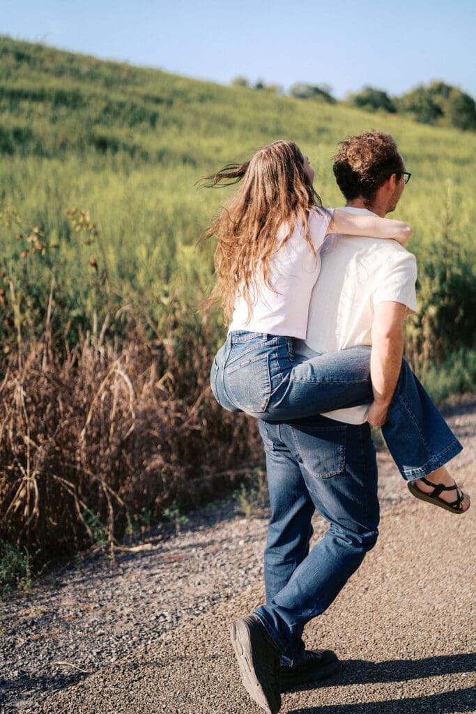 Knoxville couple dances for engagement portraits at Seven Islands State Birding Park