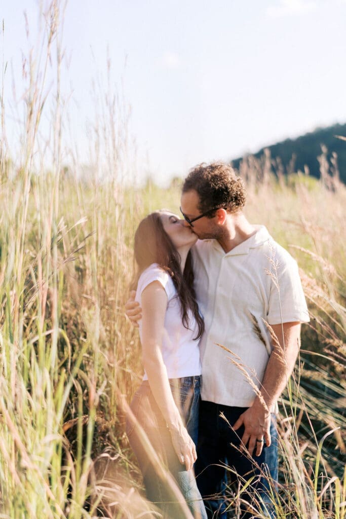 Knoxville couple posing for engagement portraits at Seven Islands State Birding Park