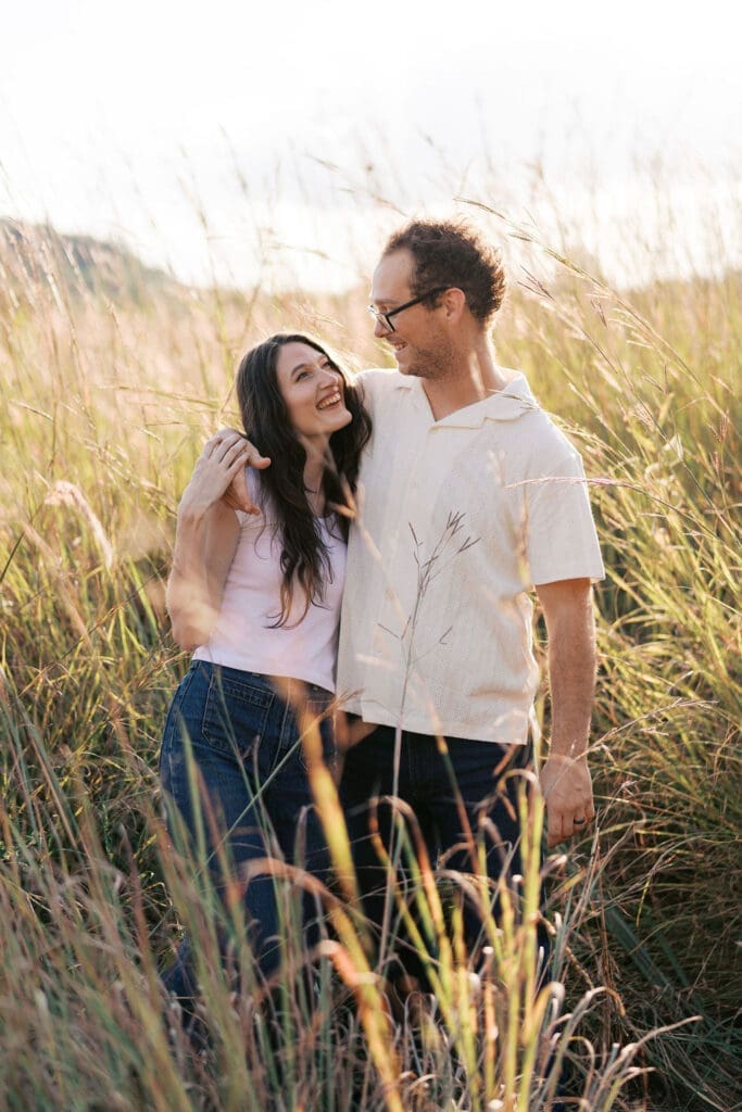 Couple standing in a field at Seven Islands during their Knoxville engagement session