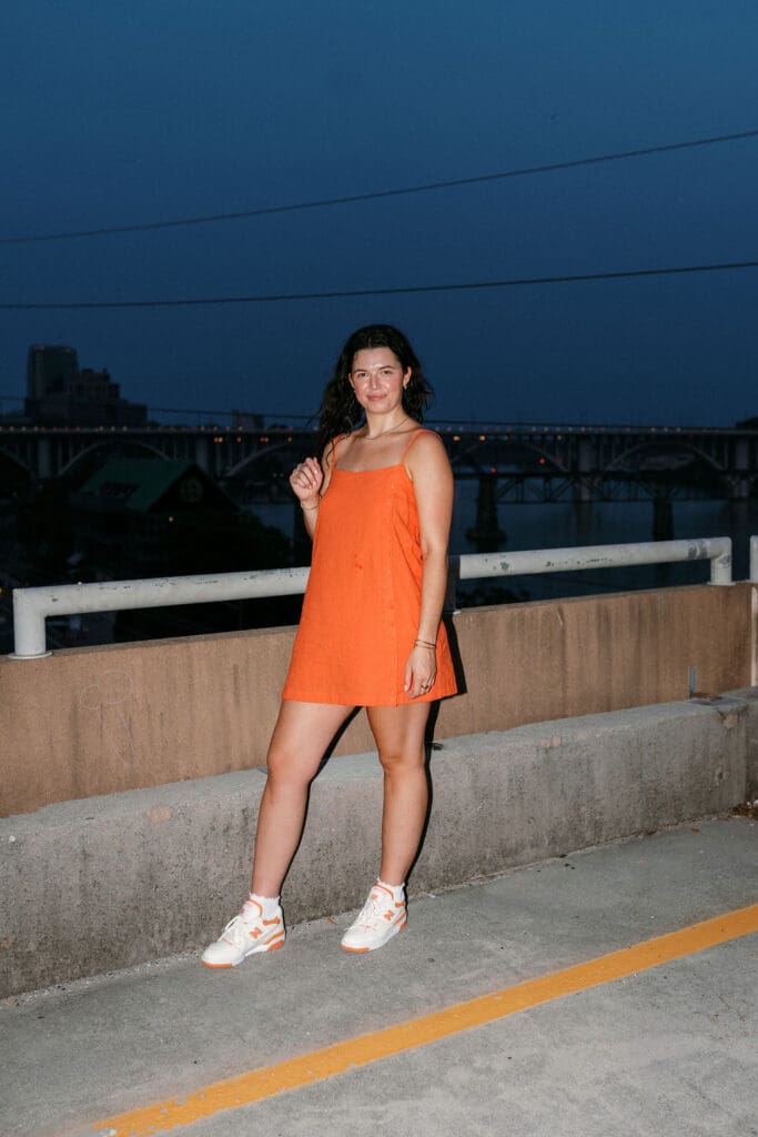 Rachel smiling on top of G10 garage during her senior photo session at the University of Tennessee Knoxville