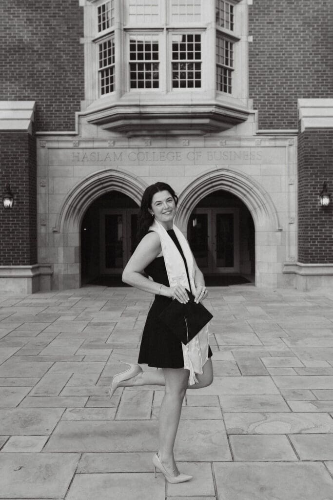 marketing major takes senior photos in front of the haslam college of business in knoxville tennessee