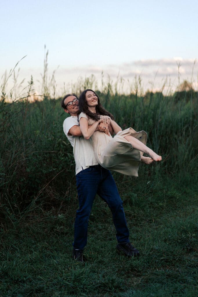 man picks up woman in field at seven islands state birding park in knoxville tennessee