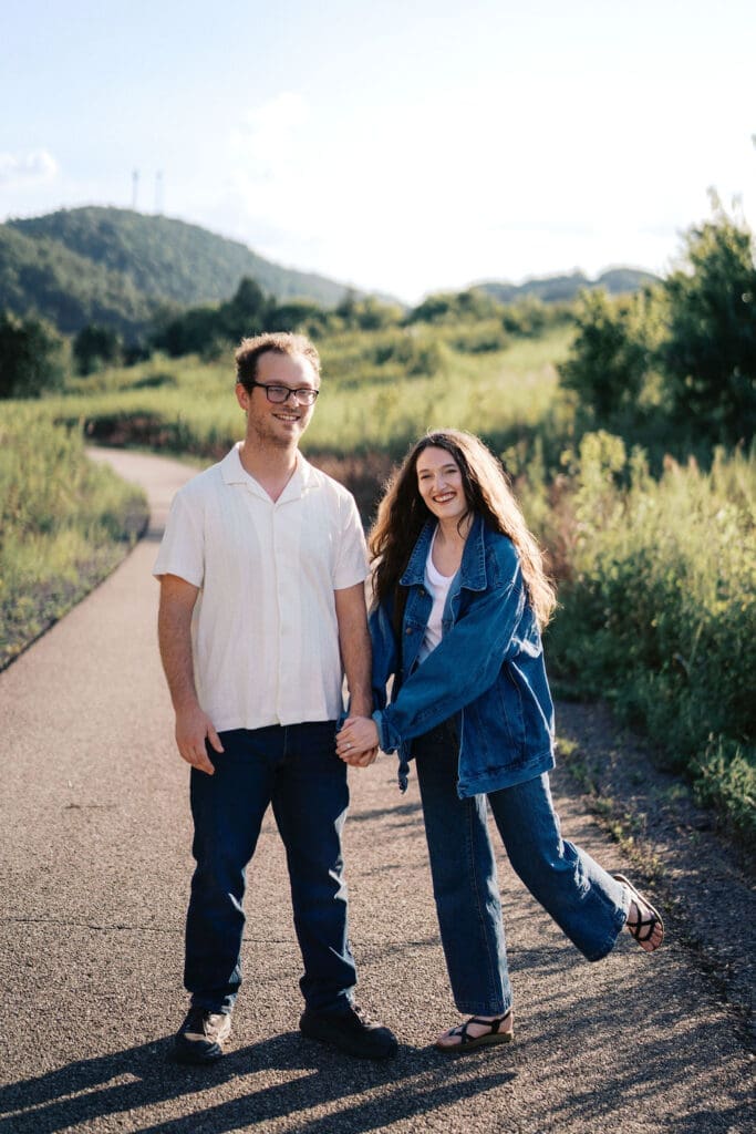 Knoxville couple posing for engagement portraits at Seven Islands State Birding Park