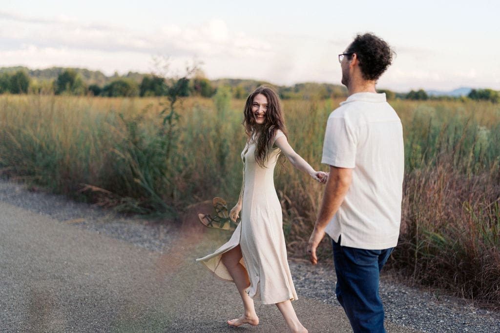 couple runs on walking trail at seven islands state birding park in knoxville tennessee
