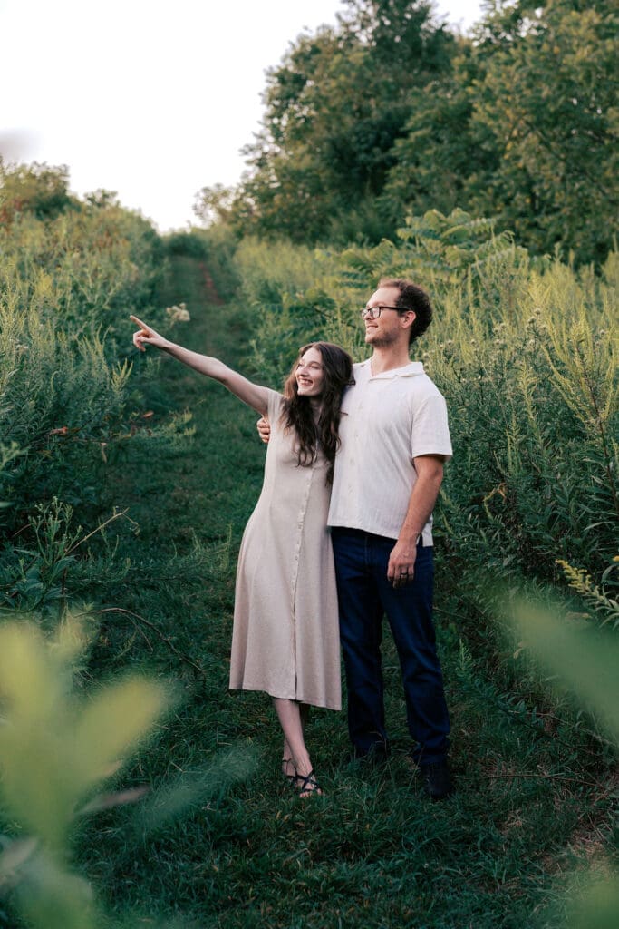 Couple standing in a field at Seven Islands during their Knoxville engagement session