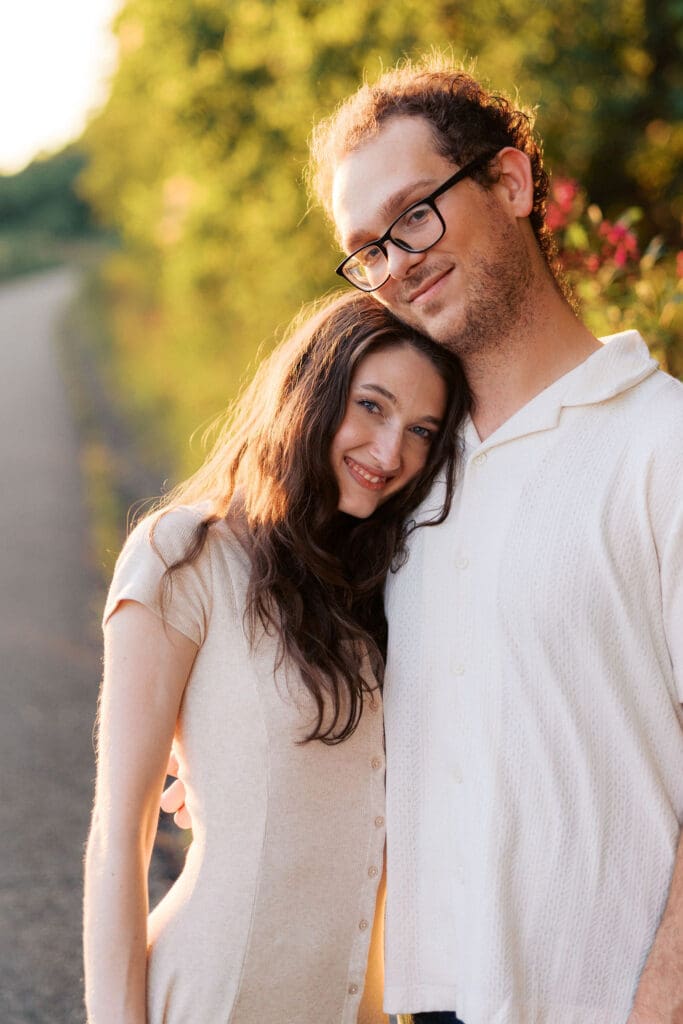 Knoxville couple hugging for engagement portraits at Seven Islands State Birding Park
