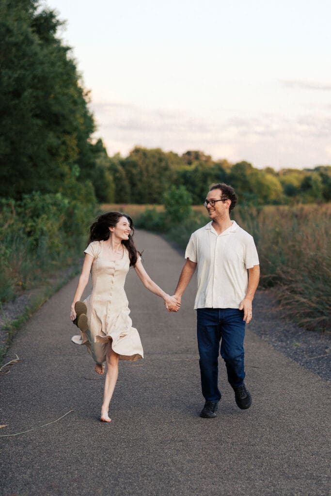 couple runs on walking trail at seven islands state birding park in knoxville tennessee