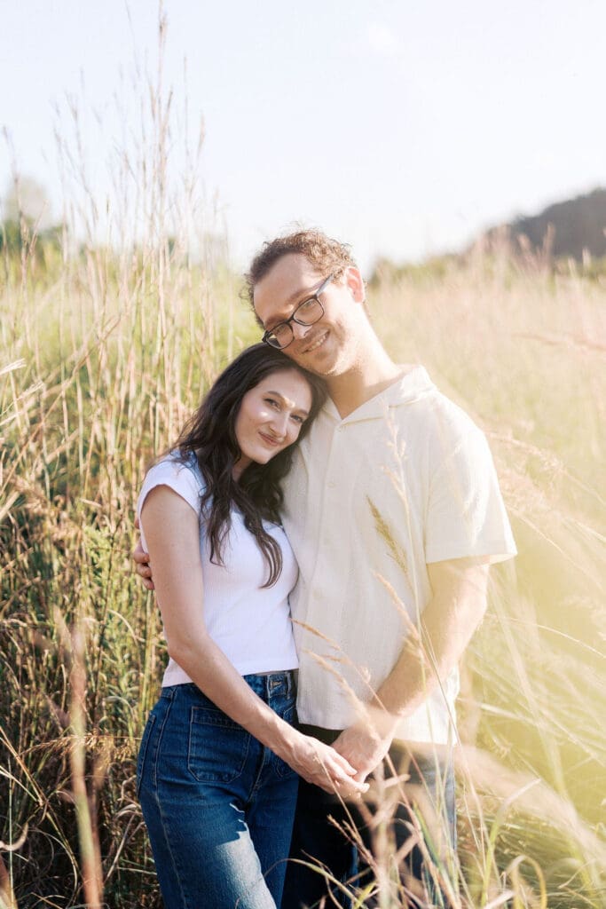 Couple standing in a field at Seven Islands during their Knoxville engagement session