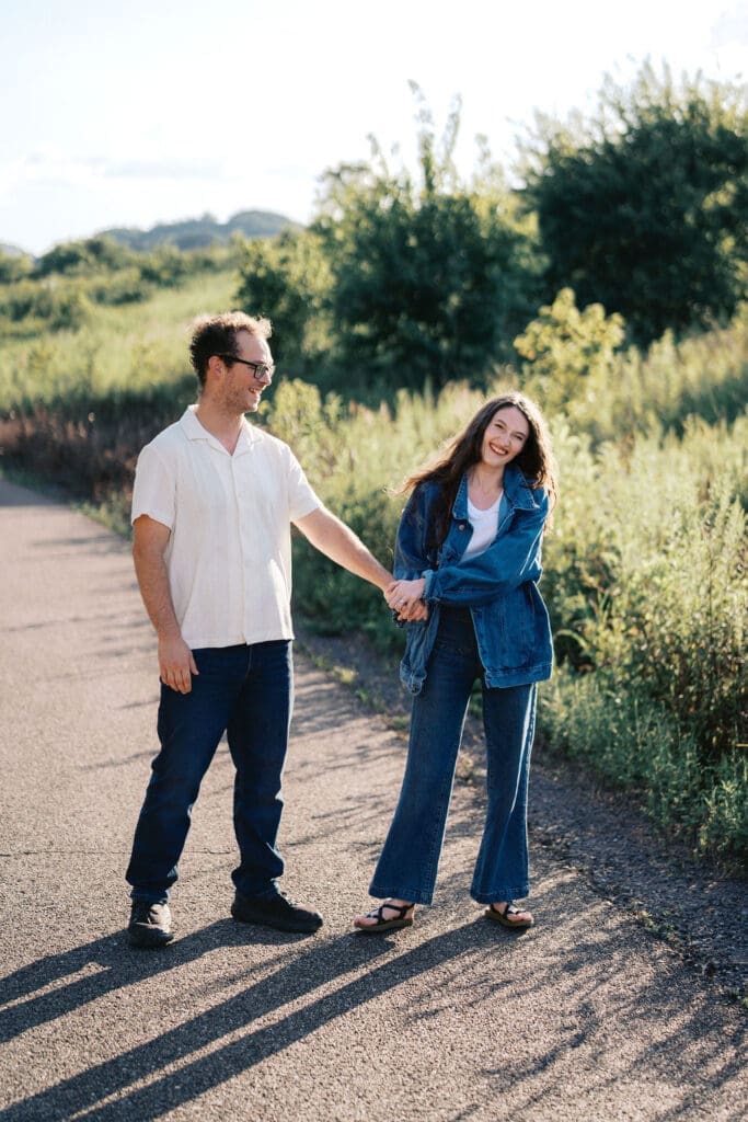Knoxville couple posing for engagement portraits at Seven Islands State Birding Park