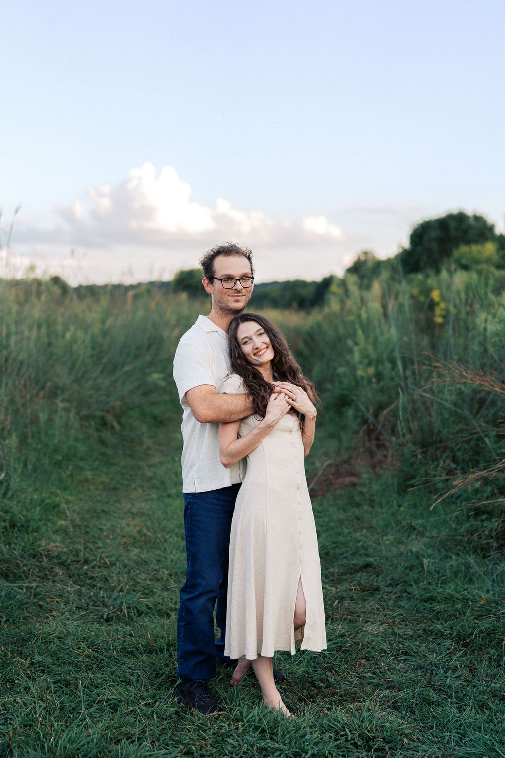 couple kisses at golden hour at seven islands state birding park in knoxville tennessee