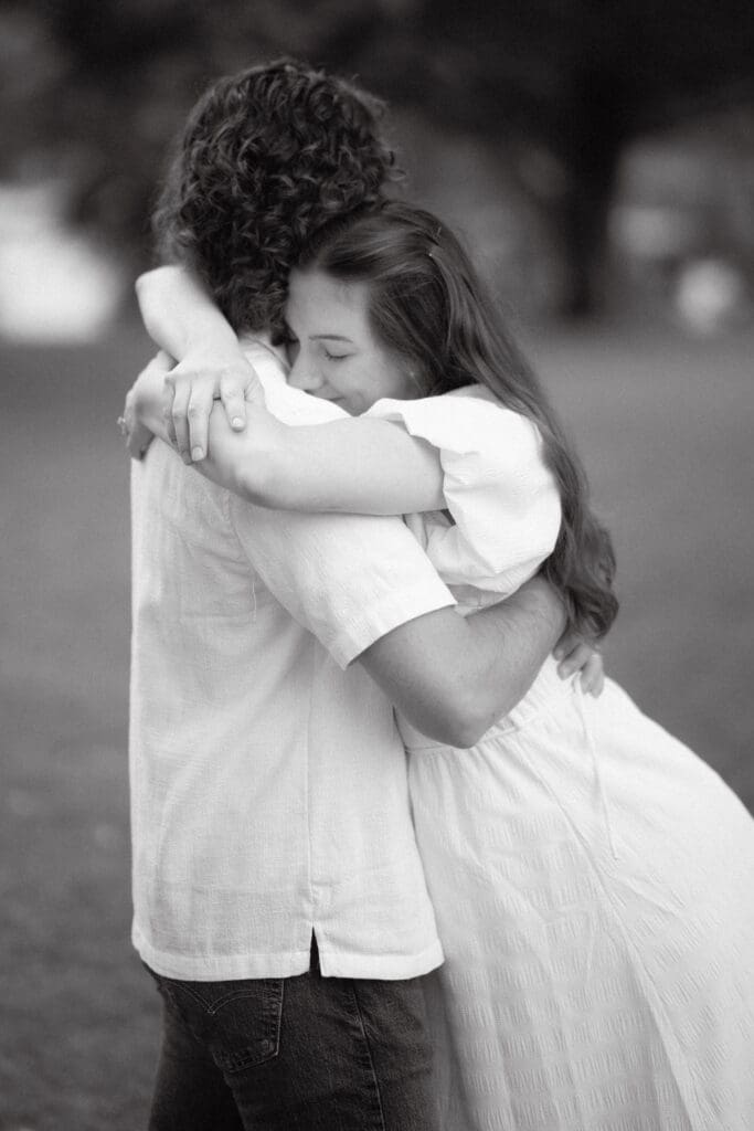 Black and white maternity portrait of expecting couple at Cove Lake State Park, Tennessee