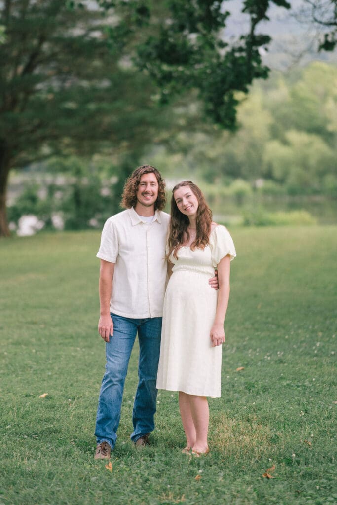 Couple embracing during maternity session in East Tennessee