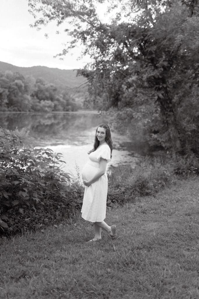 Maternity photo of an expecting mother standing beside the water at Cove Lake State Park in Tennessee taken by Knoxville maternity photographer