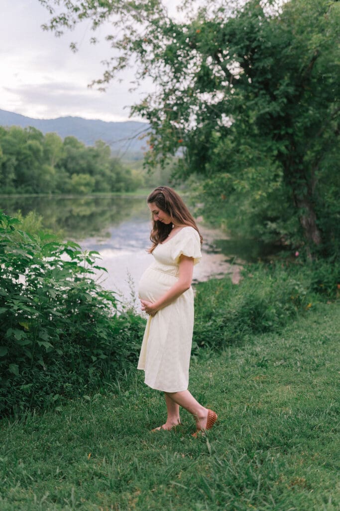 Maternity photo of an expecting mother standing beside the water at Cove Lake State Park in Tennessee taken by Knoxville maternity photographer